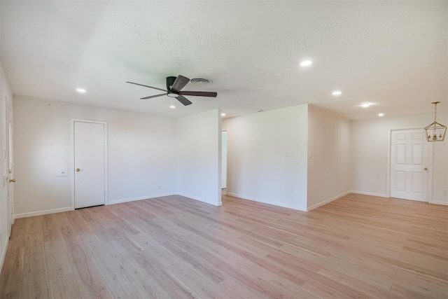 9419 Campbell Rd, Houston, TX 77080 - spare room featuring light wood finished floors, recessed lighting, baseboards, a ceiling fan, and a textured ceiling