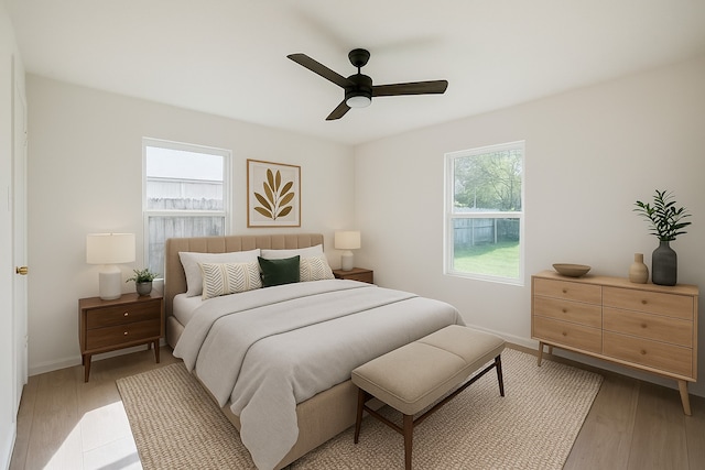 9419 Campbell Rd, Houston, TX 77080 - bedroom featuring light wood-type flooring, baseboards, and ceiling fan