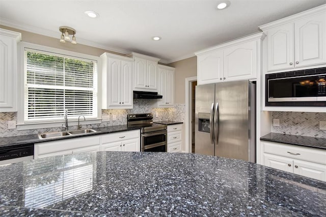 27140 Fm 365, Beaumont, TX 77705 - kitchen with appliances with stainless steel finishes, under cabinet range hood, a sink, white cabinets, and backsplash