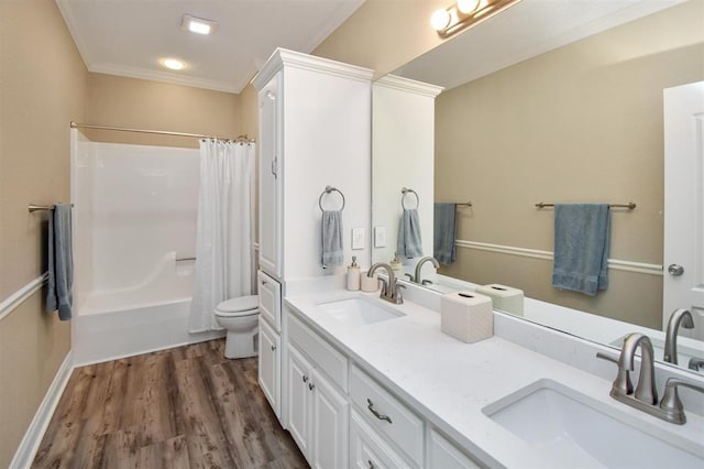 27140 Fm 365, Beaumont, TX 77705 - full bathroom with double vanity, toilet, wood finished floors, shower / tub combo with curtain, and crown molding