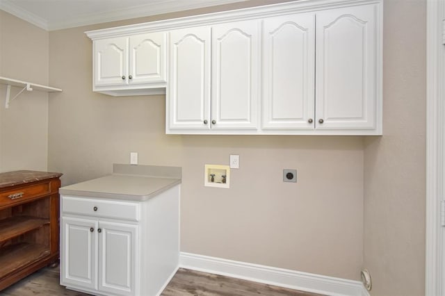 27140 Fm 365, Beaumont, TX 77705 - laundry area with cabinet space, washer hookup, wood finished floors, ornamental molding, and electric dryer hookup