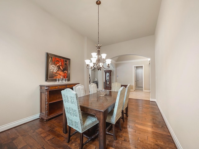 5411 Cedar Elm Ln, Fulshear, TX 77441 - dining area with arched walkways, a chandelier, baseboards, and dark wood finished floors
