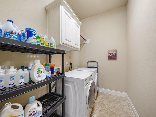 5411 Cedar Elm Ln, Fulshear, TX 77441 - laundry room featuring independent washer and dryer, light tile patterned floors, baseboards, and cabinet space