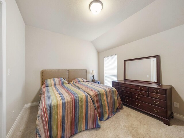 5411 Cedar Elm Ln, Fulshear, TX 77441 - bedroom with light colored carpet, baseboards, and vaulted ceiling