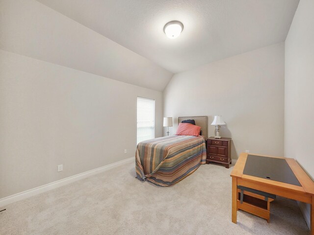 5411 Cedar Elm Ln, Fulshear, TX 77441 - bedroom with baseboards, light carpet, and lofted ceiling