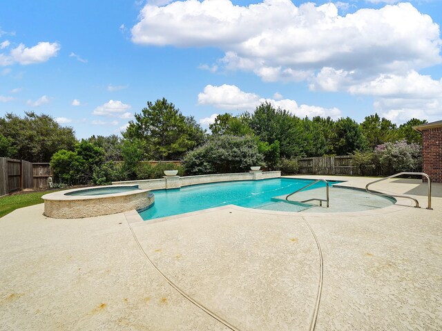 5411 Cedar Elm Ln, Fulshear, TX 77441 - view of swimming pool featuring a patio, a fenced backyard, a pool with connected hot tub, and view of scattered trees