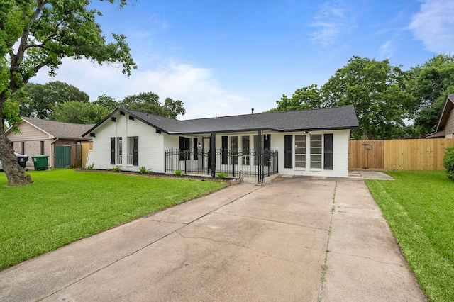 12310 New Brunswick Dr, Houston, TX 77089 - view of front of house featuring brick siding, driveway, a gate, and a shingled roof