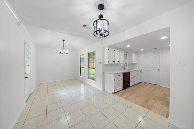 12310 New Brunswick Dr, Houston, TX 77089 - kitchen featuring a chandelier, black dishwasher, light countertops, a sink, and white cabinetry