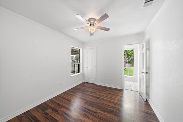 12310 New Brunswick Dr, Houston, TX 77089 - empty room featuring crown molding, dark wood-type flooring, baseboards, and a ceiling fan