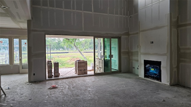9927 N Hunters Run Dr, Missouri City, TX 77459 - unfurnished living room with a fireplace