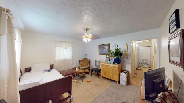 6130 Hartwick Rd, Houston, TX 77016 - bedroom with light colored carpet and a textured ceiling