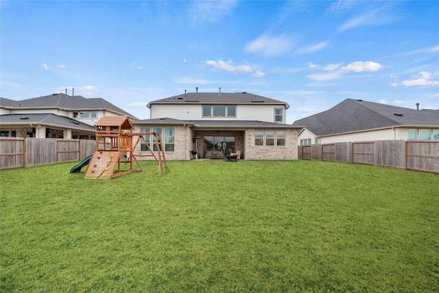 409 Stratus View Ct, Katy, TX 77493 - back of property with a playground and brick siding