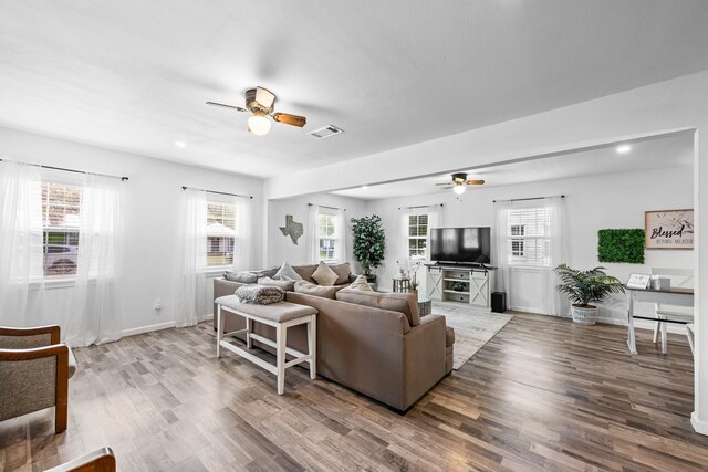 729 Kyle St, Angleton, TX 77515 - living room with ceiling fan, wood finished floors, and plenty of natural light