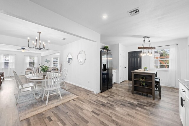 729 Kyle St, Angleton, TX 77515 - dining area featuring a chandelier, light wood finished floors, baseboards, ceiling fan, and recessed lighting