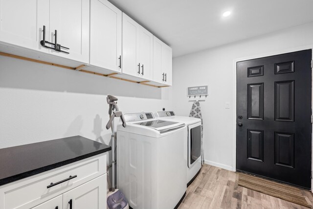 729 Kyle St, Angleton, TX 77515 - washroom featuring washing machine and clothes dryer, cabinet space, light wood-style floors, and baseboards