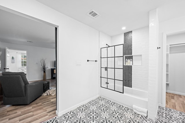 729 Kyle St, Angleton, TX 77515 - bathroom with baseboards,  shower combination, recessed lighting, and wood finished floors