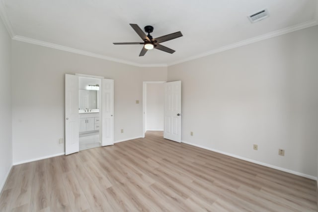 13038 Skymeadow Dr, Houston, TX 77082 - unfurnished bedroom featuring light wood-style floors, crown molding, baseboards, ensuite bathroom, and a sink
