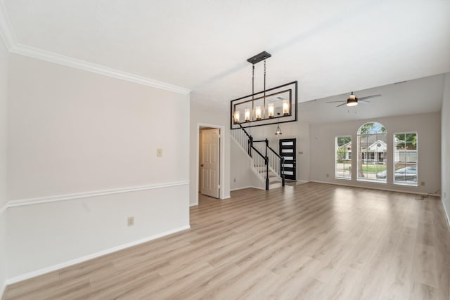 13038 Skymeadow Dr, Houston, TX 77082 - unfurnished living room featuring stairway, light wood finished floors, a ceiling fan, baseboards, and crown molding
