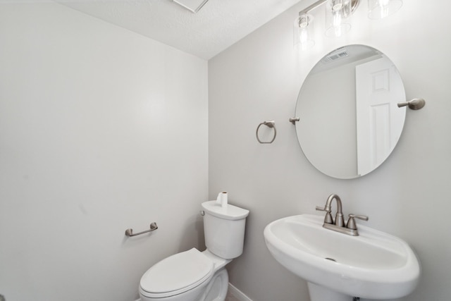 13038 Skymeadow Dr, Houston, TX 77082 - bathroom with a sink, baseboards, and toilet