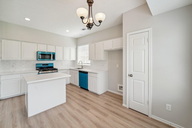 13038 Skymeadow Dr, Houston, TX 77082 - kitchen with stainless steel appliances, a sink, decorative backsplash, white cabinets, and recessed lighting