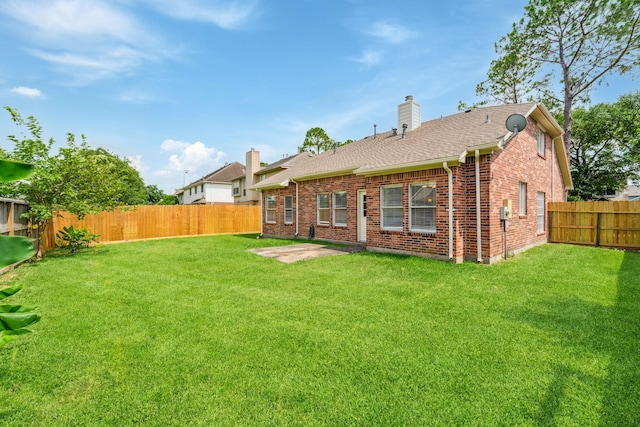 13038 Skymeadow Dr, Houston, TX 77082 - rear view of property featuring brick siding, a chimney, and a shingled roof