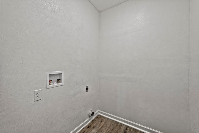3247 Bolton Gardens Dr, Houston, TX 77066 - laundry room with electric dryer hookup, dark wood-type flooring, baseboards, and hookup for a washing machine