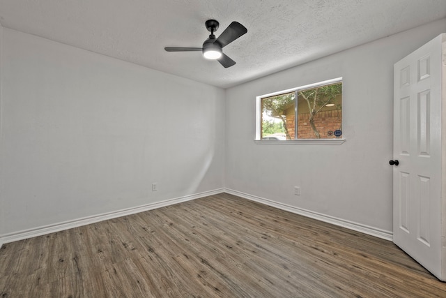 3247 Bolton Gardens Dr, Houston, TX 77066 - spare room with wood finished floors, baseboards, a textured ceiling, and ceiling fan