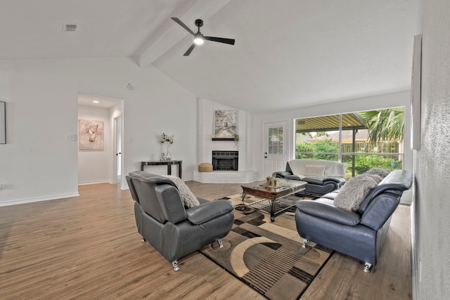 3247 Bolton Gardens Dr, Houston, TX 77066 - living area featuring a ceiling fan, a fireplace, wood finished floors, and baseboards