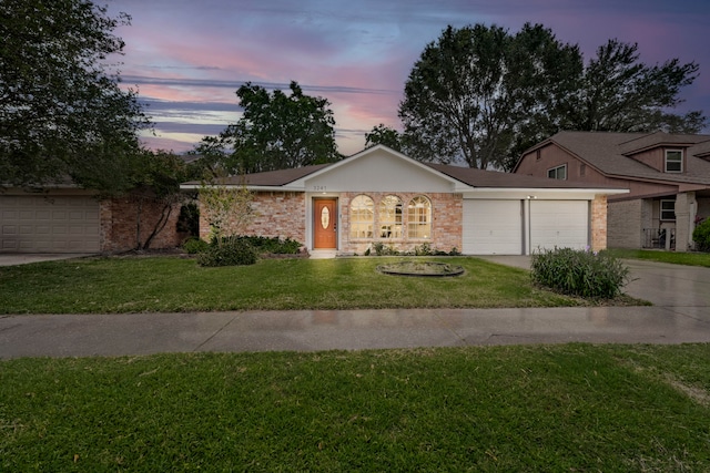 3247 Bolton Gardens Dr, Houston, TX 77066 - ranch-style house with concrete driveway, an attached garage, a front yard, and brick siding