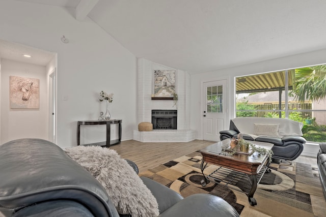 3247 Bolton Gardens Dr, Houston, TX 77066 - living room with a brick fireplace, wood finished floors, and baseboards