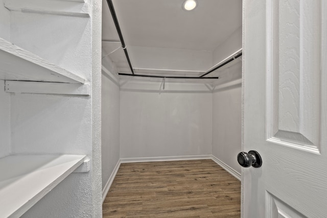 3247 Bolton Gardens Dr, Houston, TX 77066 - walk in closet featuring wood finished floors