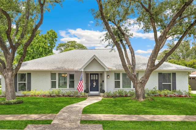 7730 Pagewood Ln, Houston, TX 77063 - ranch-style home with brick siding, a front yard, and a shingled roof