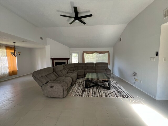 2134 Collingsfield Dr, Sugar Land, TX 77478 - living area with a chandelier, lofted ceiling, a ceiling fan, and baseboards