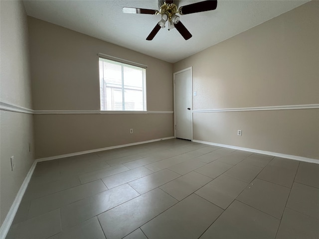 2134 Collingsfield Dr, Sugar Land, TX 77478 - tiled empty room featuring a ceiling fan and baseboards