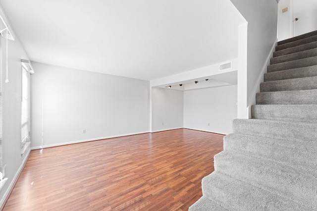 10345 Longmont Dr, Houston, TX 77042 - stairs with wood finished floors and baseboards