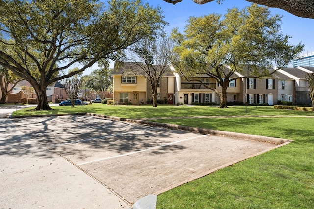 10345 Longmont Dr, Houston, TX 77042 - view of community featuring a lawn