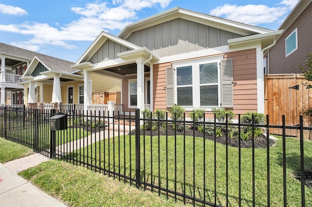 2517 S Houston Ave, Pearland, TX 77581 - view of front of home featuring covered porch, board and batten siding, and a gate