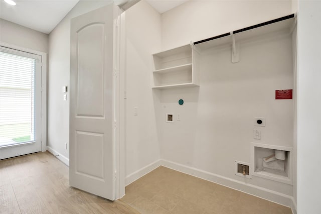 2517 S Houston Ave, Pearland, TX 77581 - laundry room with electric dryer hookup, healthy amount of natural light, baseboards, and washer hookup