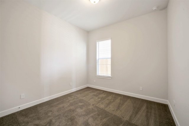 2517 S Houston Ave, Pearland, TX 77581 - empty room with dark colored carpet, baseboards, and a smoke detector