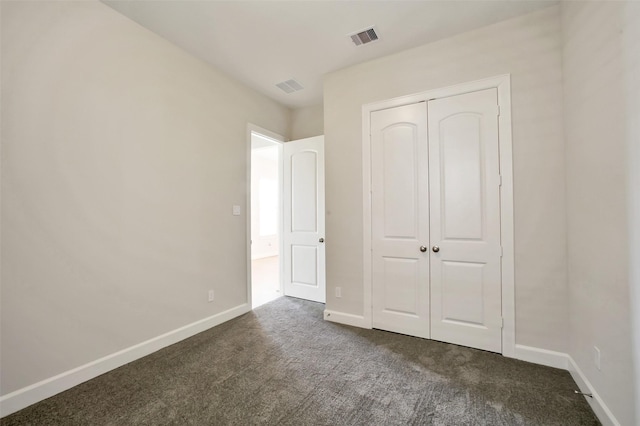 2517 S Houston Ave, Pearland, TX 77581 - unfurnished bedroom featuring dark colored carpet, baseboards, and a closet