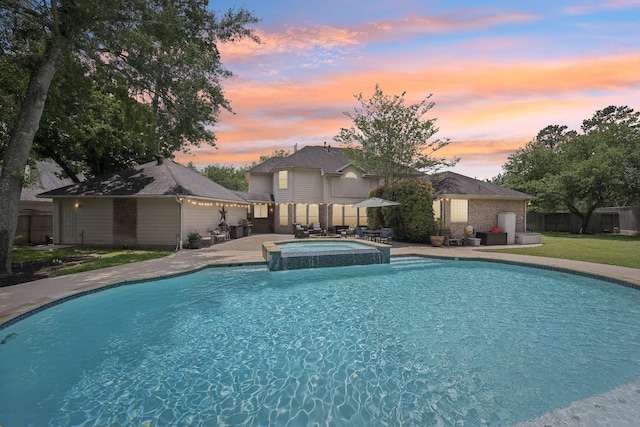 12106 Via Chianti Ct, Cypress, TX 77429 - pool at dusk with a patio area and a pool with connected hot tub