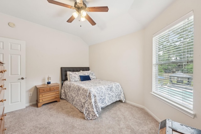 12106 Via Chianti Ct, Cypress, TX 77429 - bedroom with multiple windows, vaulted ceiling, carpet, baseboards, and ceiling fan