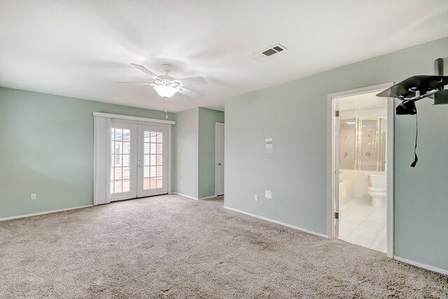 3920 Blackberry Ln, Port Arthur, TX 77642 - unfurnished bedroom featuring carpet flooring, french doors, baseboards, and ensuite bathroom