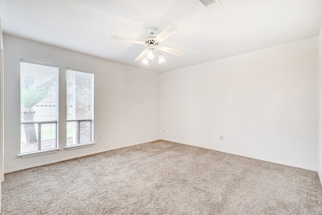 3920 Blackberry Ln, Port Arthur, TX 77642 - unfurnished room with carpet floors and a ceiling fan