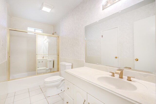 3920 Blackberry Ln, Port Arthur, TX 77642 - bathroom with tile patterned flooring, toilet, enclosed tub / shower combo, and vanity