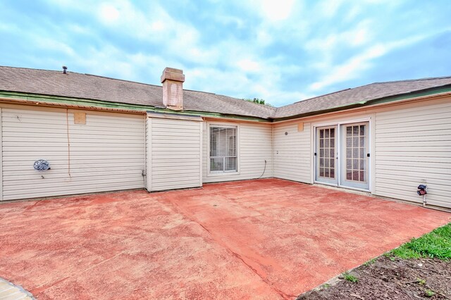 3920 Blackberry Ln, Port Arthur, TX 77642 - rear view of property with a patio and a chimney