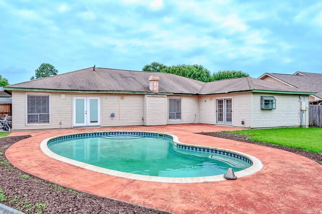 3920 Blackberry Ln, Port Arthur, TX 77642 - outdoor pool featuring french doors and a patio area