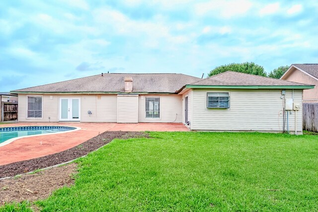 3920 Blackberry Ln, Port Arthur, TX 77642 - back of house featuring french doors and a patio