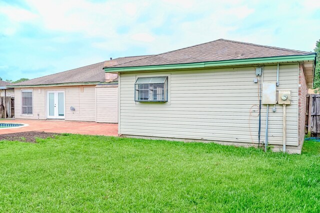 3920 Blackberry Ln, Port Arthur, TX 77642 - back of house featuring a patio area, french doors, and roof with shingles
