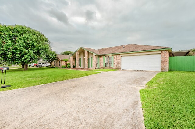 3920 Blackberry Ln, Port Arthur, TX 77642 - view of front of house featuring concrete driveway, an attached garage, and brick siding